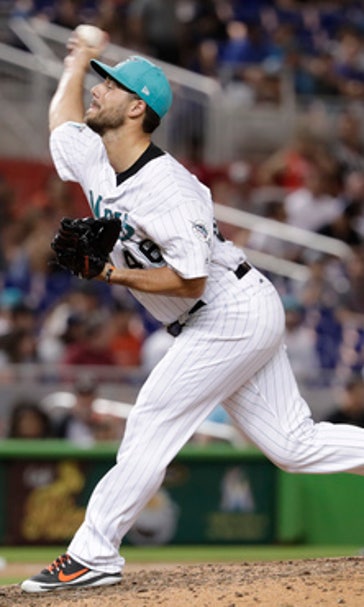 Smith pitches, hits Marlins to 4-0 win over Padres